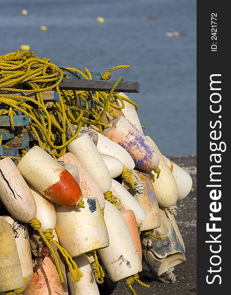 Buoys and yellow rope on  the beach