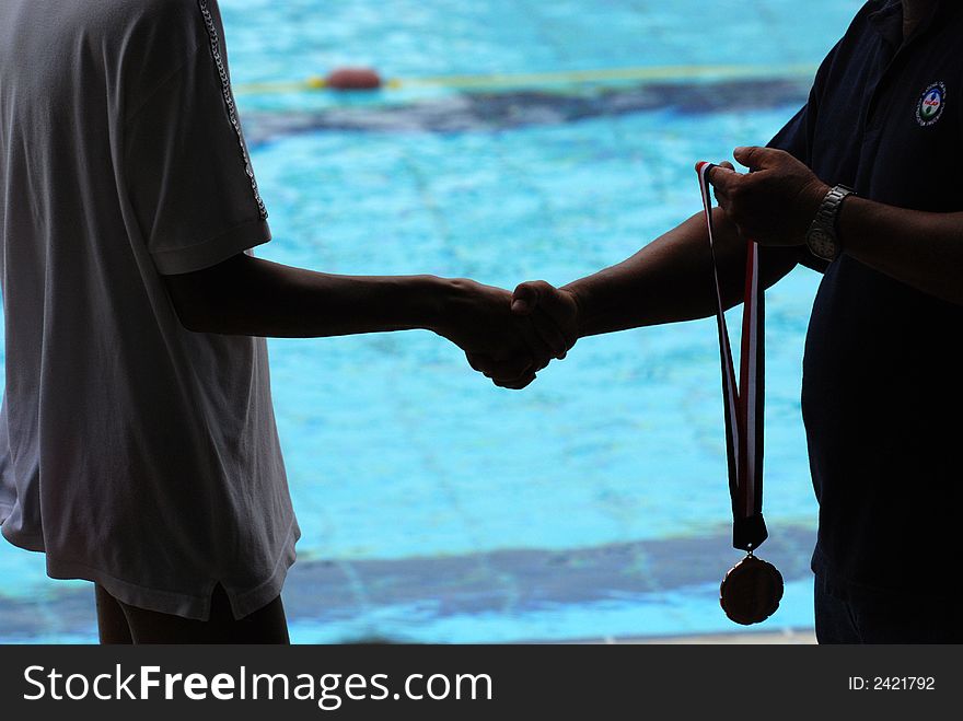 Swimming competition prize presentation in the sport center. Swimming competition prize presentation in the sport center