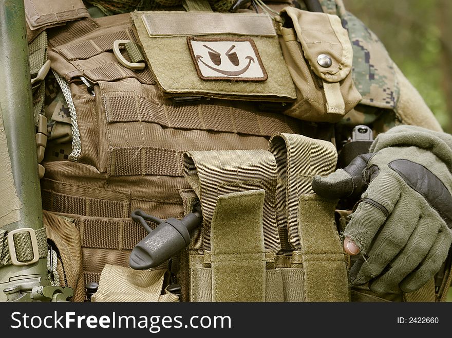 Detail of an armed U.S. Marine corps soldier.