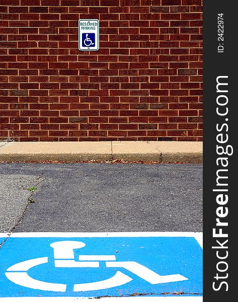 I composed this photograph during a bright day so the blue symbol on the concrete and the red in the brick wall would stand out. I composed this photograph during a bright day so the blue symbol on the concrete and the red in the brick wall would stand out.