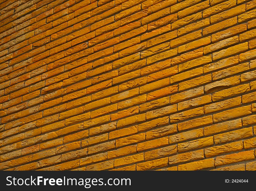 Brick wall painted in yellow. Brick wall painted in yellow