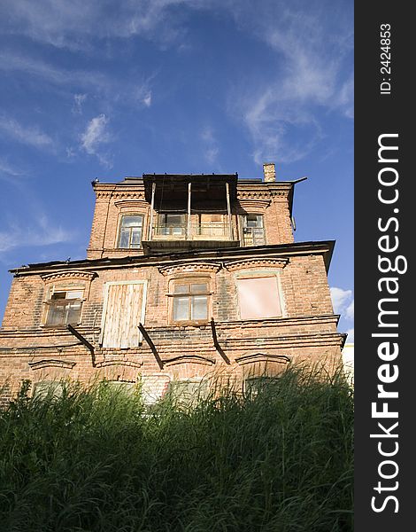 Blue sky old house green grass sunny day. Blue sky old house green grass sunny day