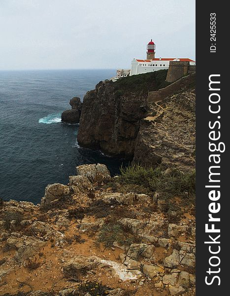 Lighthouse and some ruins on a cape in southern europe. Lighthouse and some ruins on a cape in southern europe.