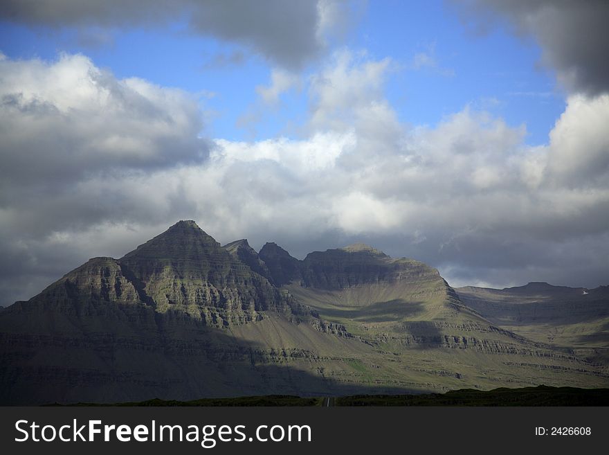 Sunlit green mountains in Iceland. Sunlit green mountains in Iceland