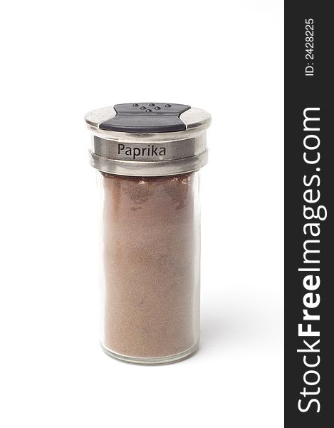 A jar of Paprika isolated on a white backgorund