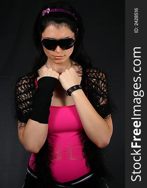 Young women wearing black sunglasess, isolated on black background. Young women wearing black sunglasess, isolated on black background