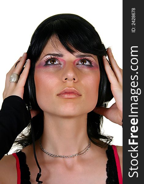 Beautiful brunette girl listening music, isolated on white background