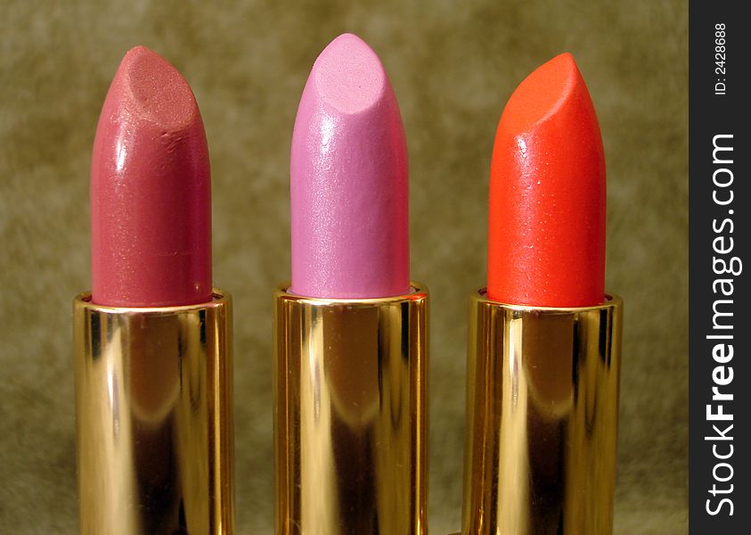 Three colored lipsticks