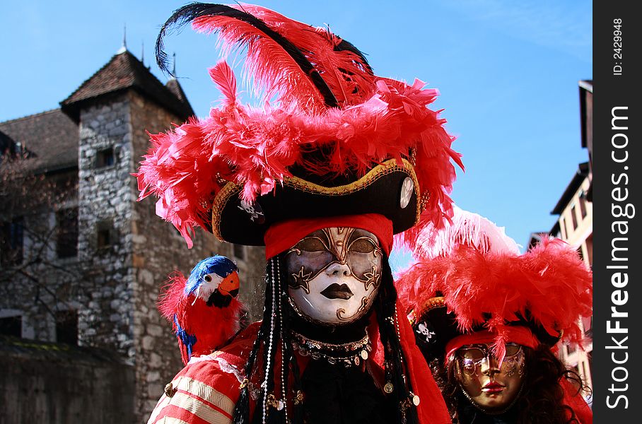 A Couple wearing Venetian Mask with Medieval Background. A Couple wearing Venetian Mask with Medieval Background