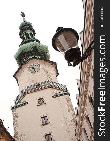 The Tower on Michal Gate (slovak: Michalska brana) and an ancient street lamp. Bratislava, Slovak republic. The Tower on Michal Gate (slovak: Michalska brana) and an ancient street lamp. Bratislava, Slovak republic.