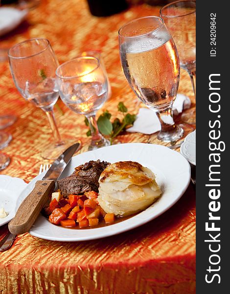 A dinner of meat and vegetables during a wedding or other catered event. A dinner of meat and vegetables during a wedding or other catered event