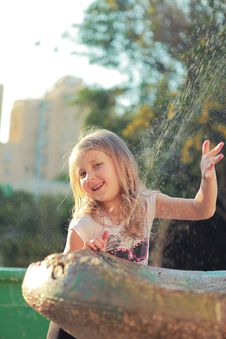 Girl Near The Fountain Stock Photos