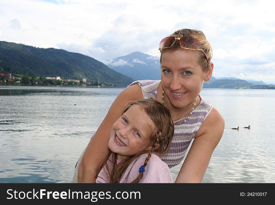 Beauty young mother with her daughter on the swisslake. Beauty young mother with her daughter on the swisslake
