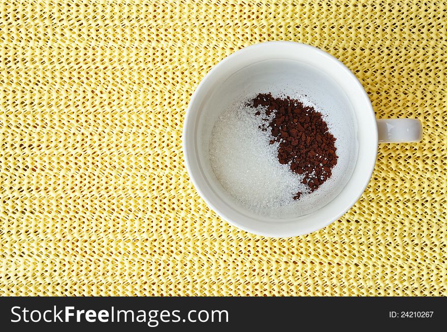 A cup of hot coffee mix in top view