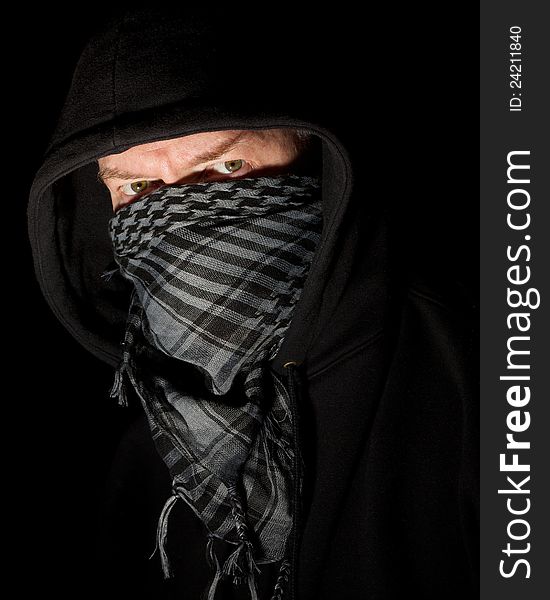 Masked robber wearing hoodie