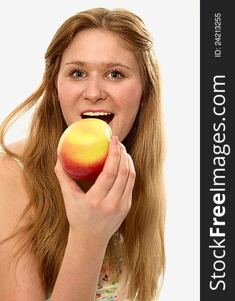 A young girl with an apple in her hand