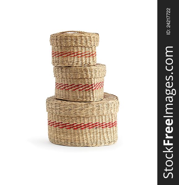 Stack of three wicker baskets on white background. Isolated with clipping path