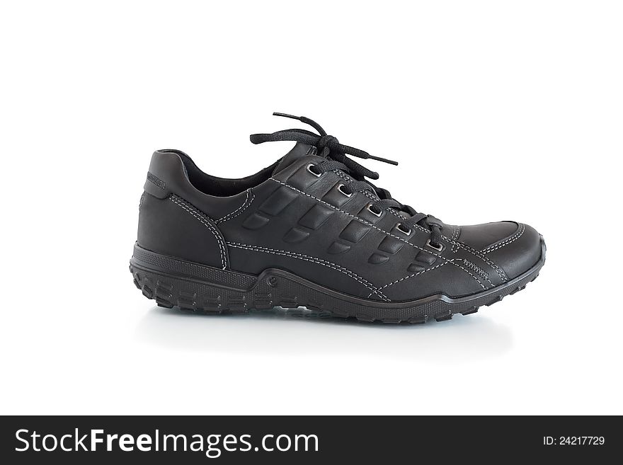 One new leather sport shoe on white background. Isolated with clipping path. One new leather sport shoe on white background. Isolated with clipping path