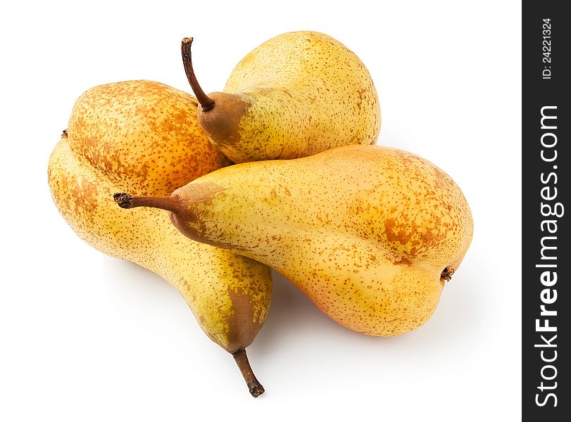 Three yellow pears against white background