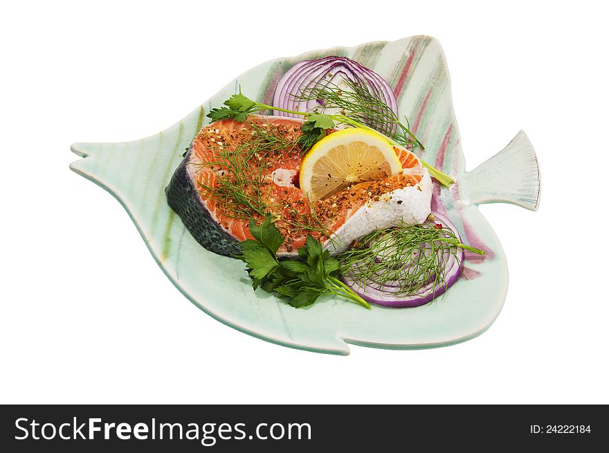 Fresh Pacific Salmon steak with herbs and spices on a plate