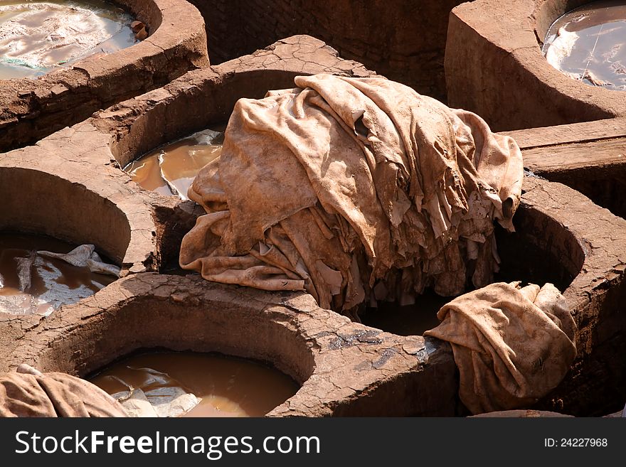 Tradtional old way of dyeing leather, tanneries, Fes, Morocco. Tradtional old way of dyeing leather, tanneries, Fes, Morocco