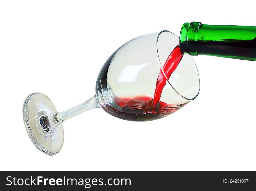 The glass with red wine is isolated on a white background