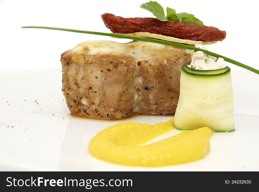 Roasted meat with mustard sauce on a white background. Roasted meat with mustard sauce on a white background