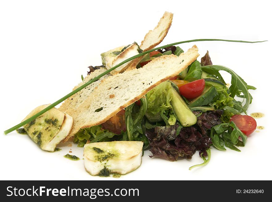 Salad vegetables and goat cheese on a white background. Salad vegetables and goat cheese on a white background