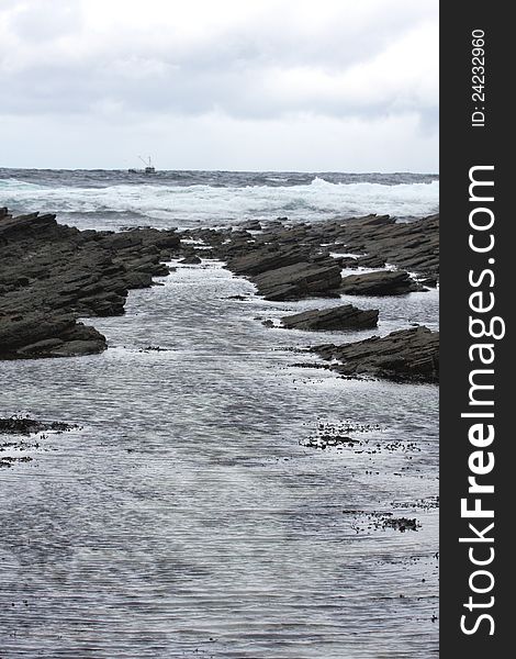 Waves Breaking on a Rocky Beach