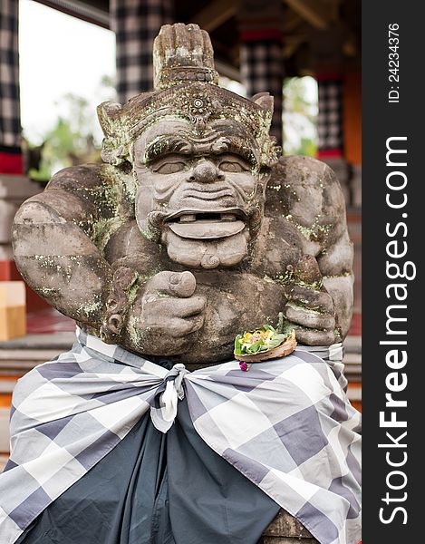 Statue of Balinese demon in Ubud, Indonesia