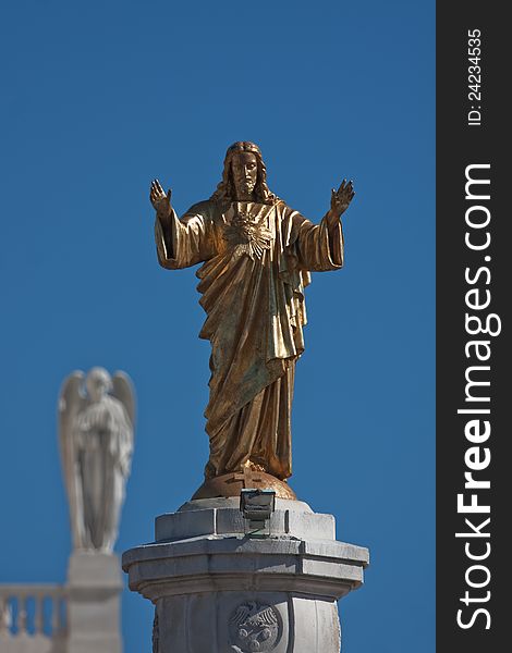 Golden Jesus Statue at the famous pilgrimage site of Fatima in Portugal