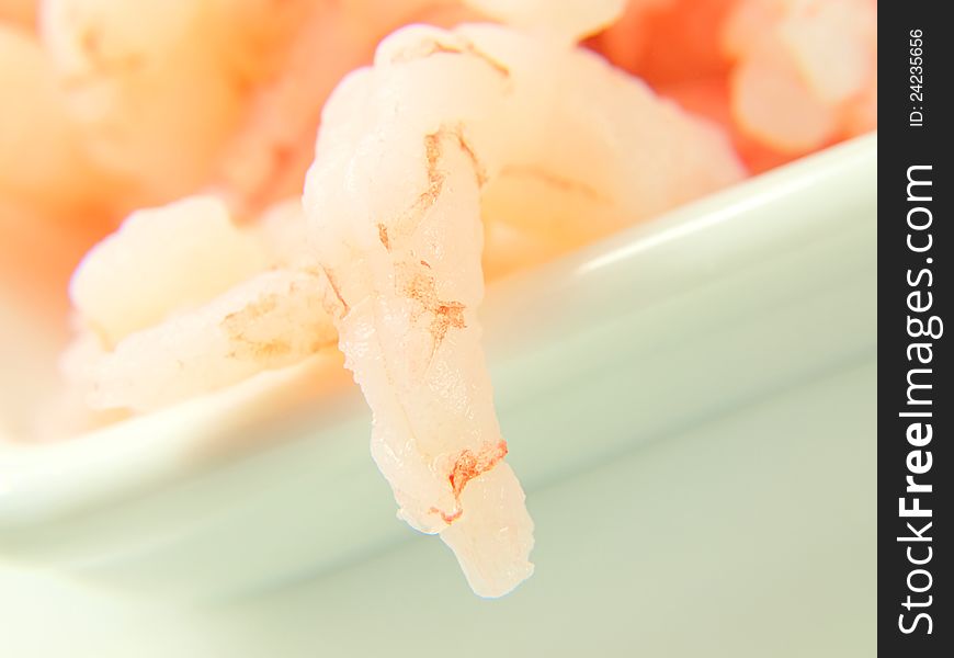 Peeled shrimps, in a white bowl