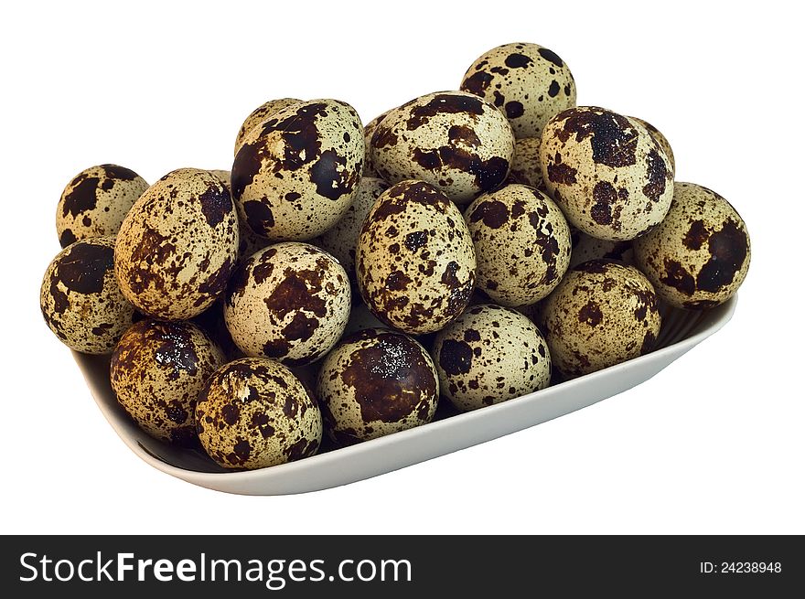 The photo shows quail eggs  close up on white background