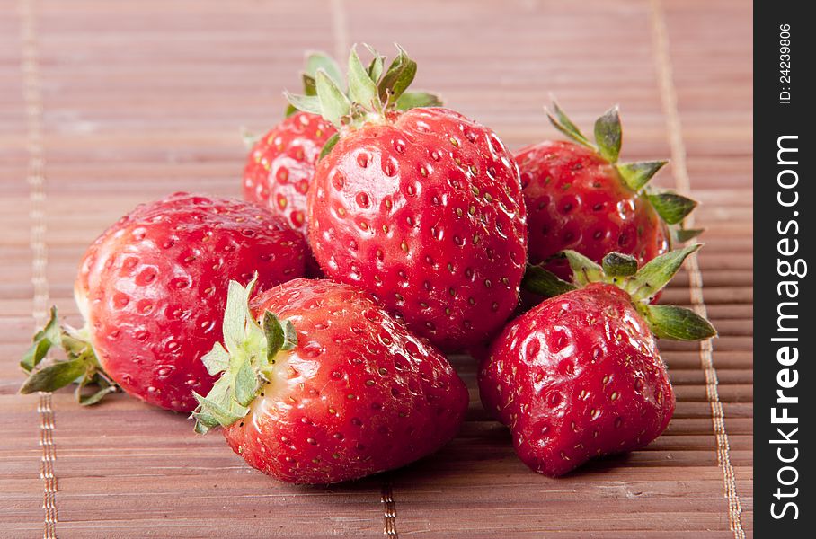 Strawberry wooden background close up