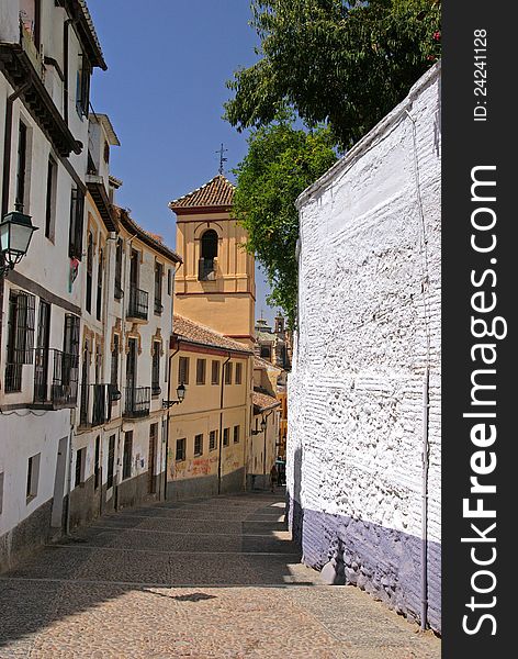 Old narrow street in Granada, Spain