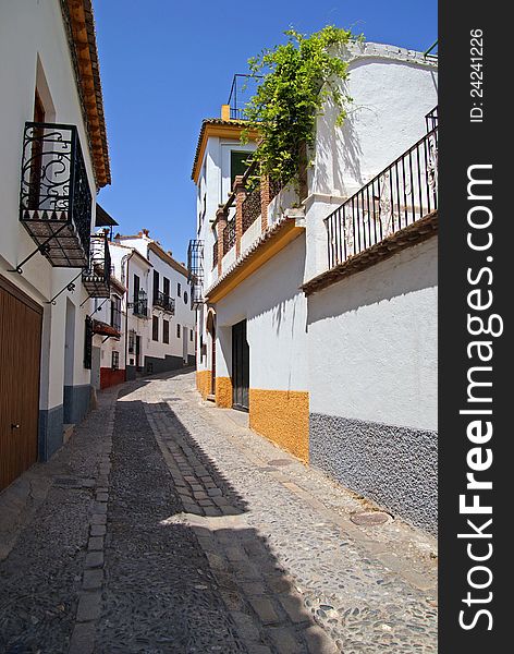 Old white buildings in Granada, Spain