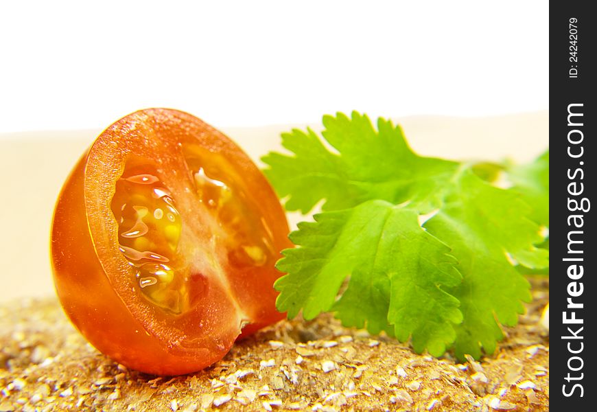 Half tomato on cracker with parsley