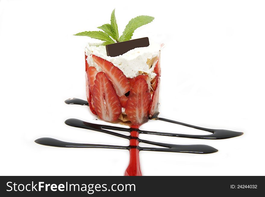 Strawberry dessert decorated with mint on a white background