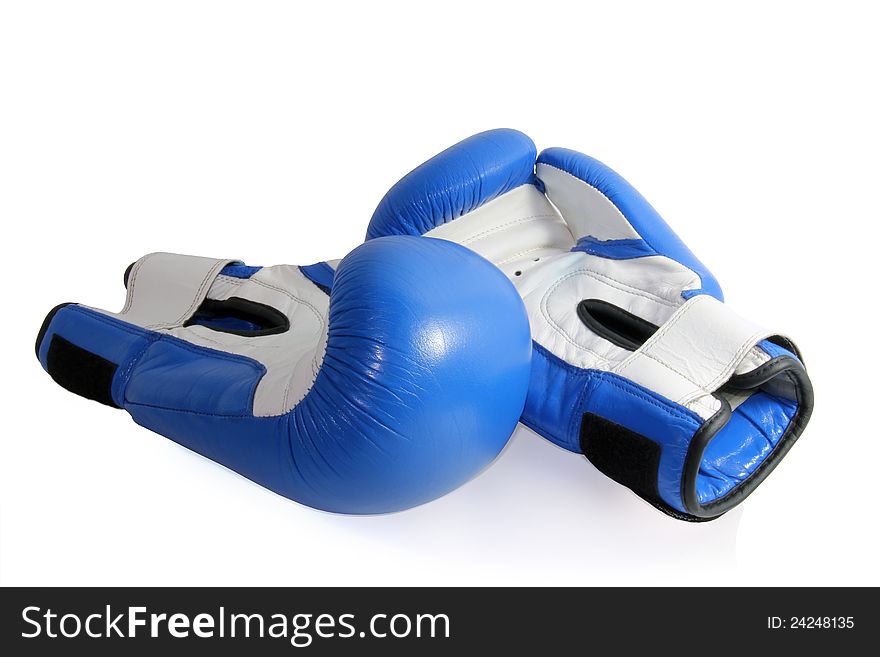 Blue and white boxing gloves are on a white background. Blue and white boxing gloves are on a white background