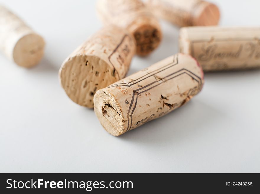 Group of wine corks on white background, shallow DOF. Group of wine corks on white background, shallow DOF