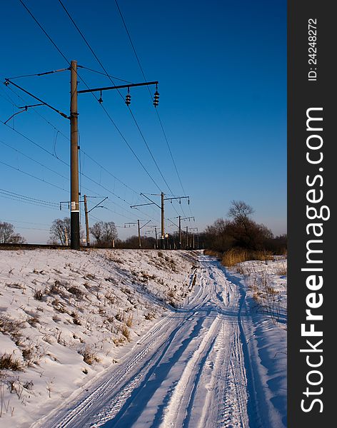Winter railroad and countryside road. Winter railroad and countryside road