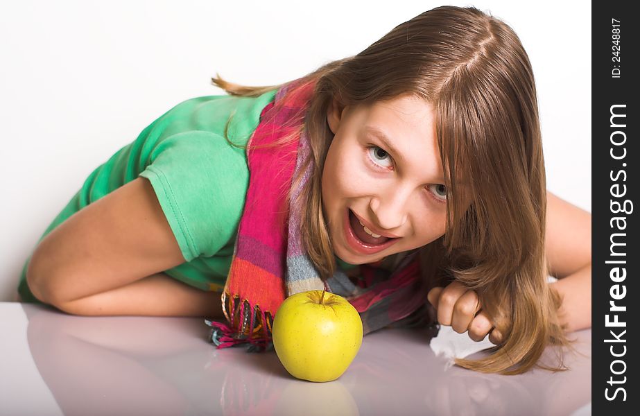 Teen attacks an apple like a tiger. This colourful picture illustrates growing popularity of vegetarian food. Teen attacks an apple like a tiger. This colourful picture illustrates growing popularity of vegetarian food.