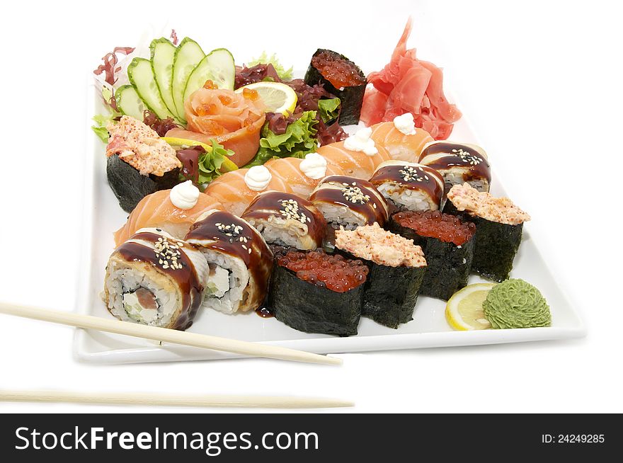Large plate of sushi caviar salmon and eel on a white background