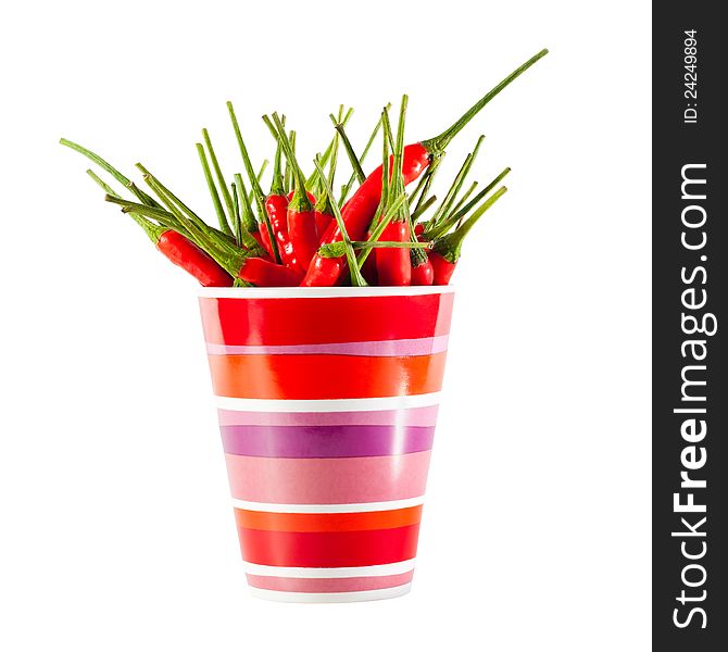 Red peppers in a mug isolated on a white background