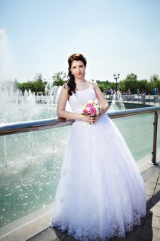Happy Bride About Fountain With Bouquet Stock Images Happy Bride About Fountain With Bouquet Stock Images