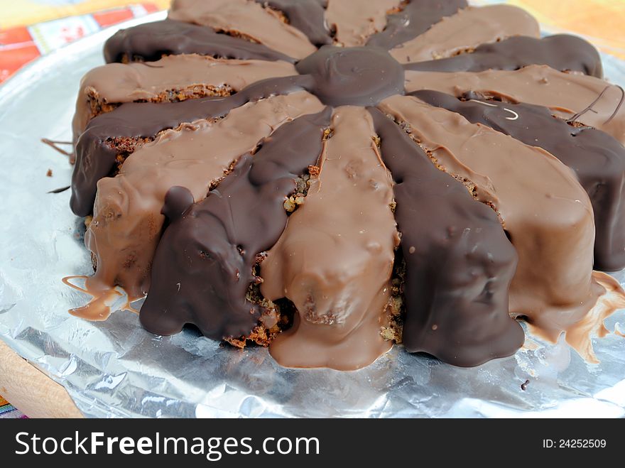 Almond cake covered with milk and dark chocolate. Almond cake covered with milk and dark chocolate