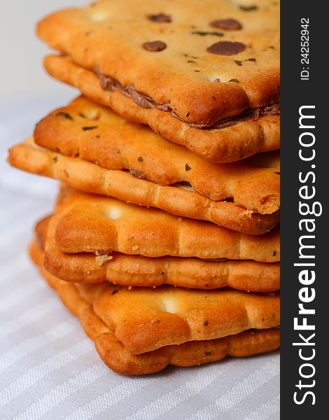 A Few Biscuits Stacked over each other over a tablecloth. A Few Biscuits Stacked over each other over a tablecloth