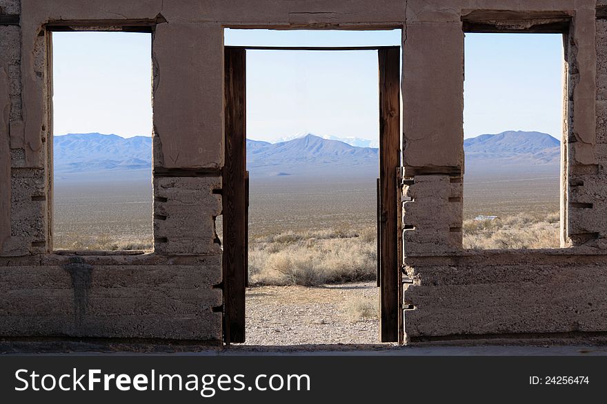 View from inside ruins at Rhyolite, a ghost town in Nevada, near Death Valley. View from inside ruins at Rhyolite, a ghost town in Nevada, near Death Valley