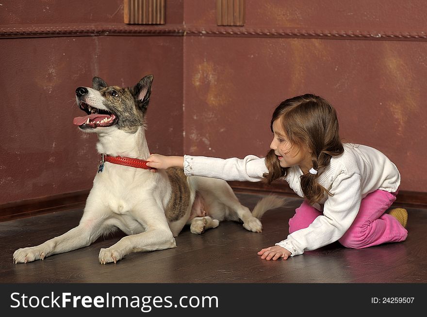 Portrait of a little girl with dog