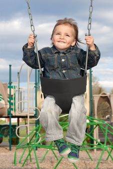 Young Boy Swinging Royalty Free Stock Images